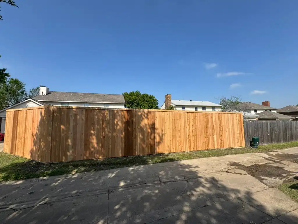 Eight-foot side-by-side cedar privacy fence between close-set homes