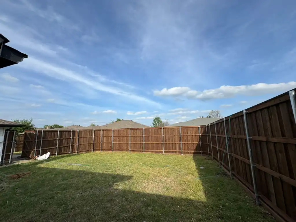 Cedar privacy fence enclosing a tidy backyard