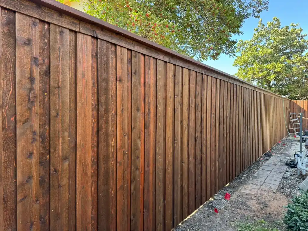 Finished cedar privacy fence with straight lines and tight pickets