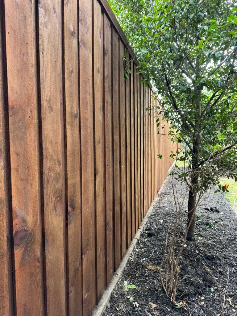 Close-up of overlapping board-on-board cedar pickets