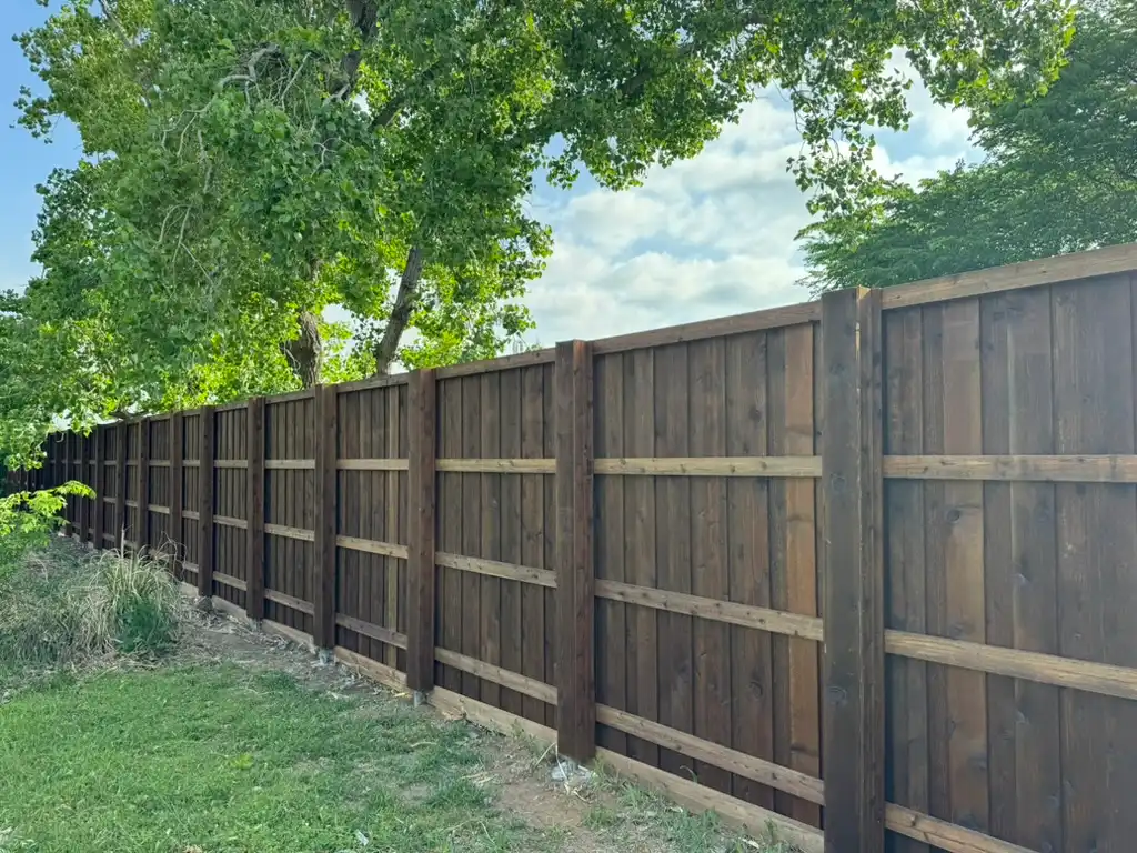 Boxed posts on a pre-stained board-on-board cedar fence