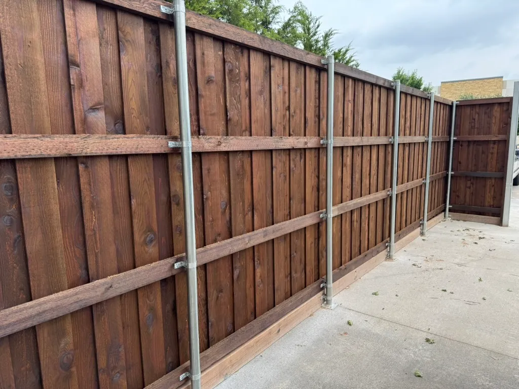 Commercial board-on-board privacy fence screening a business property