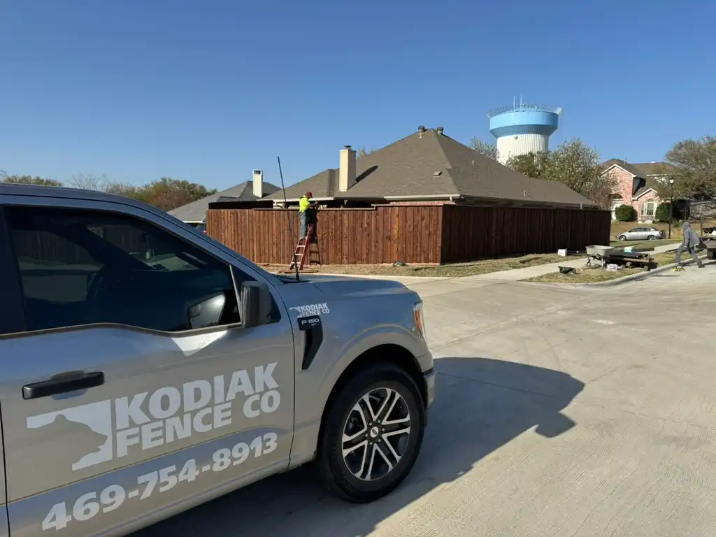 Kodiak crew and truck on a wood fence installation