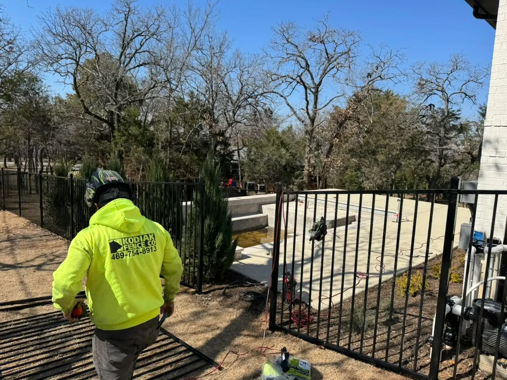Kodiak Fence Company crew installing a pool fence