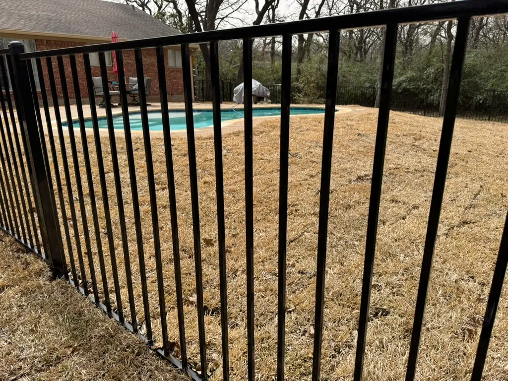 Ornamental pool fence with code-compliant gate