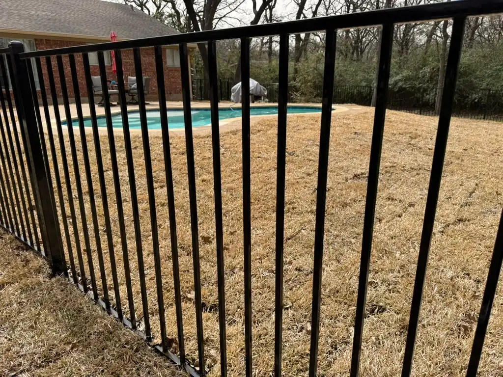 Ornamental metal pool fence with self-latching gate