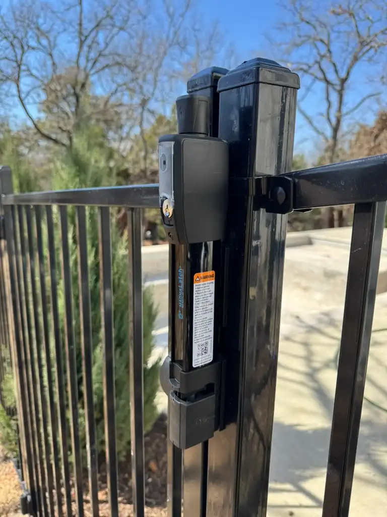 Pool safety gate latch on a Kodiak-installed pool fence gate