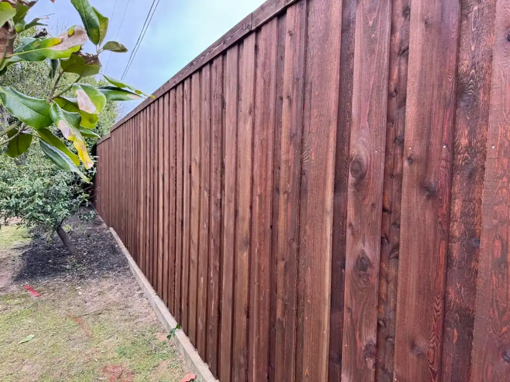 Finished cedar fence installation with tight, even pickets