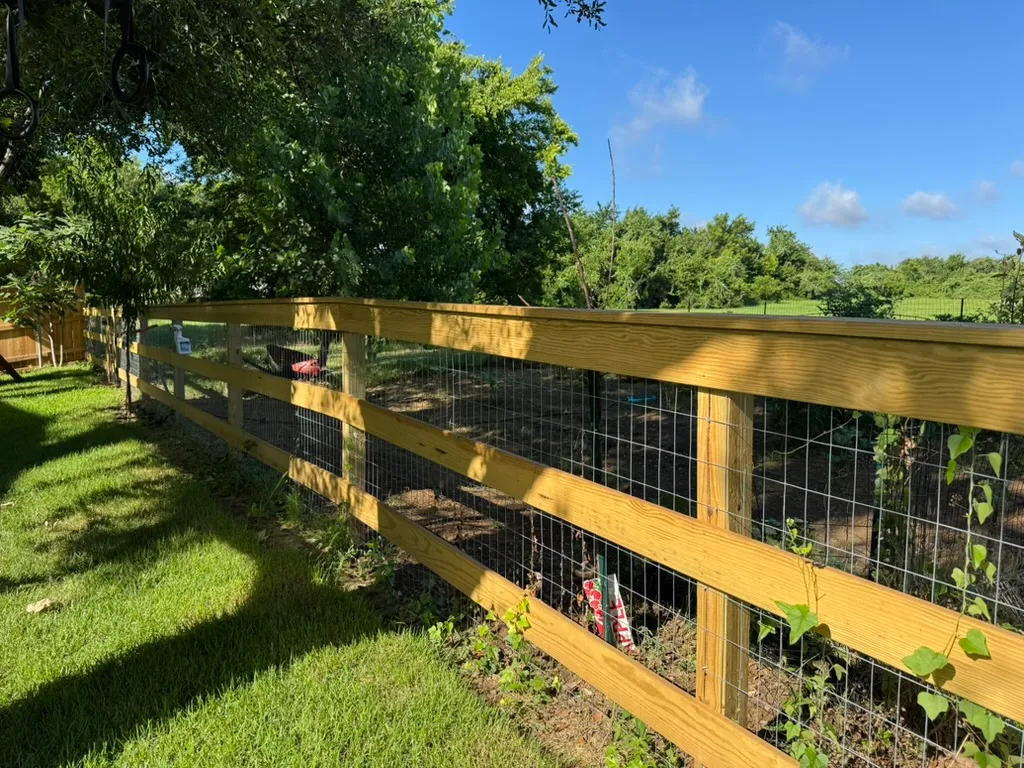 Ranch fence with a top cap rail