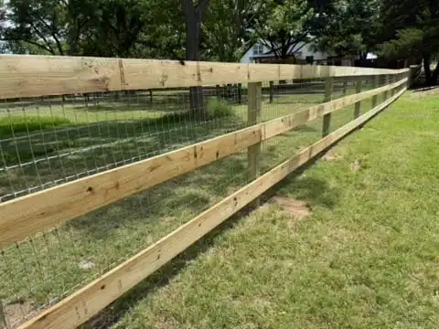 Ranch rail fence with woven horse wire behind the rails