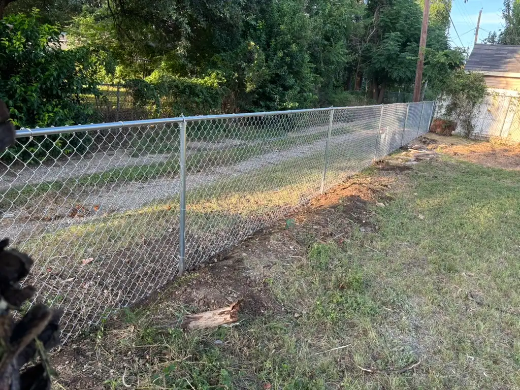 Residential chain link fence in a North DFW backyard
