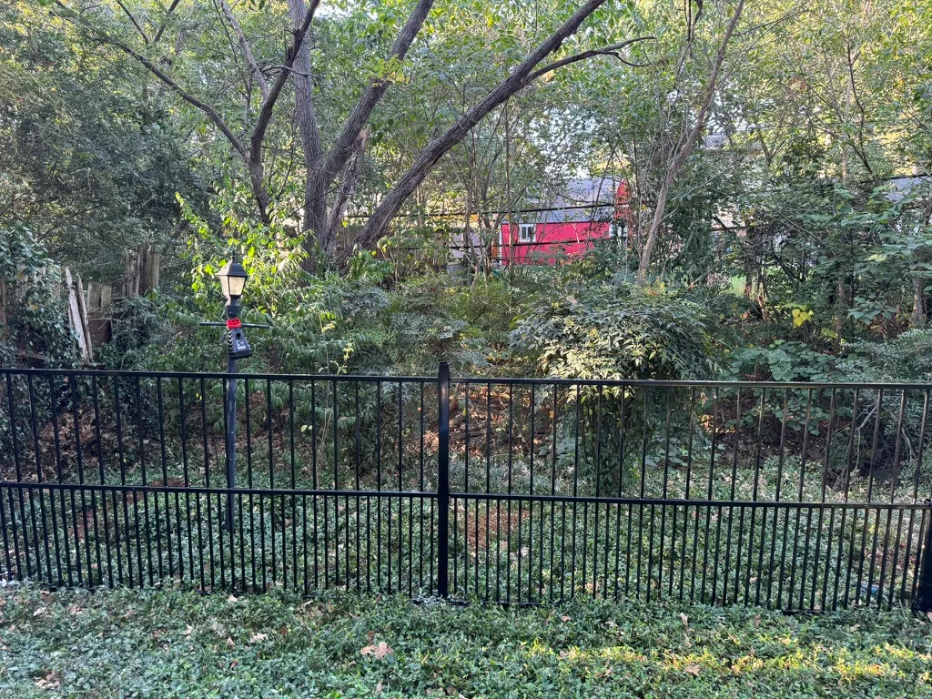 Steel fence with puppy panels to keep small dogs contained
