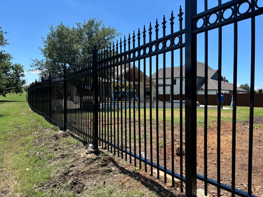 Ornamental wrought iron fence installation in Flower Mound